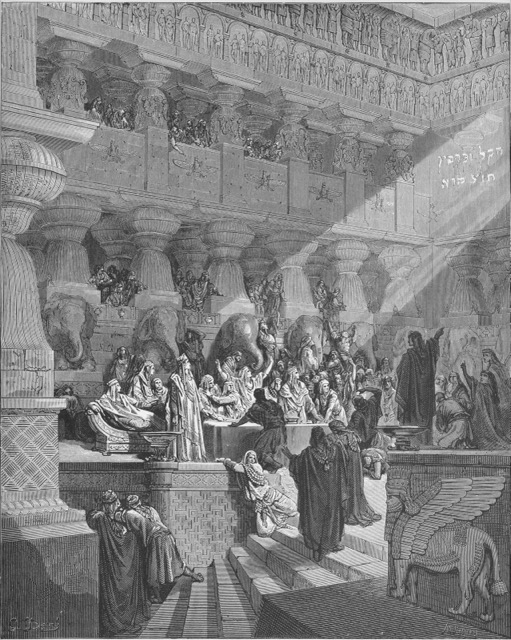Engraving of Daniel reading the writing on the wall before the terrified king